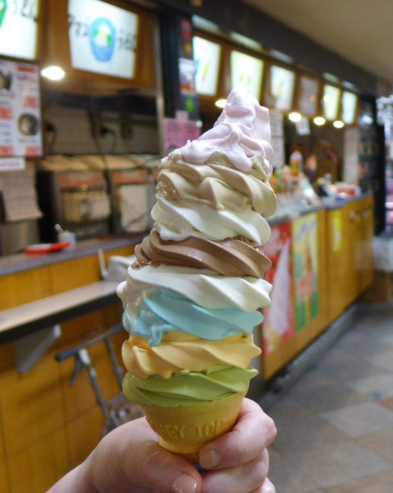 A really tall ice cream cone with 8 flavours in Tokyo