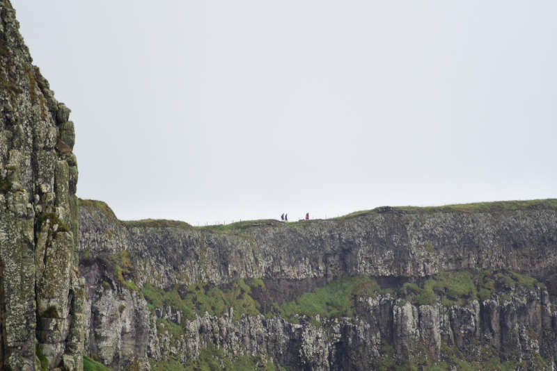 Away a wee walk - small people on a big cliff