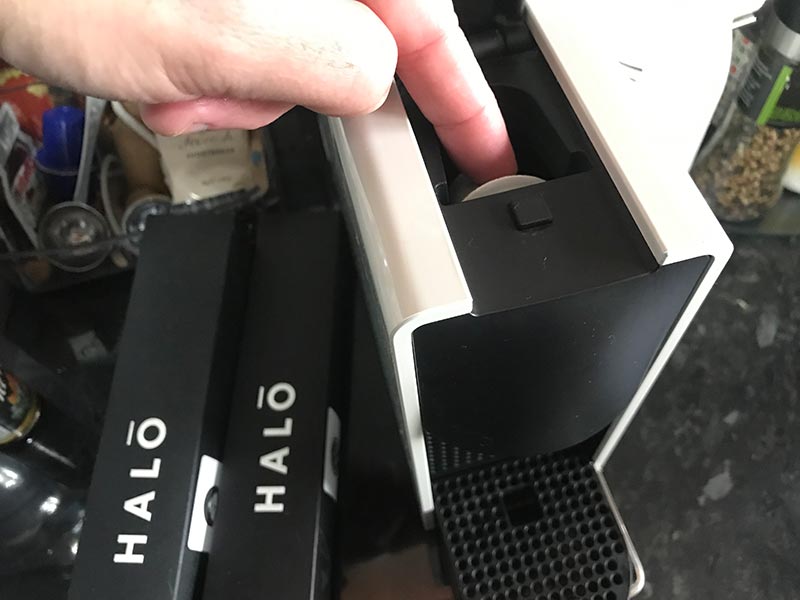 Halo coffee pod being inserted into Nespresso