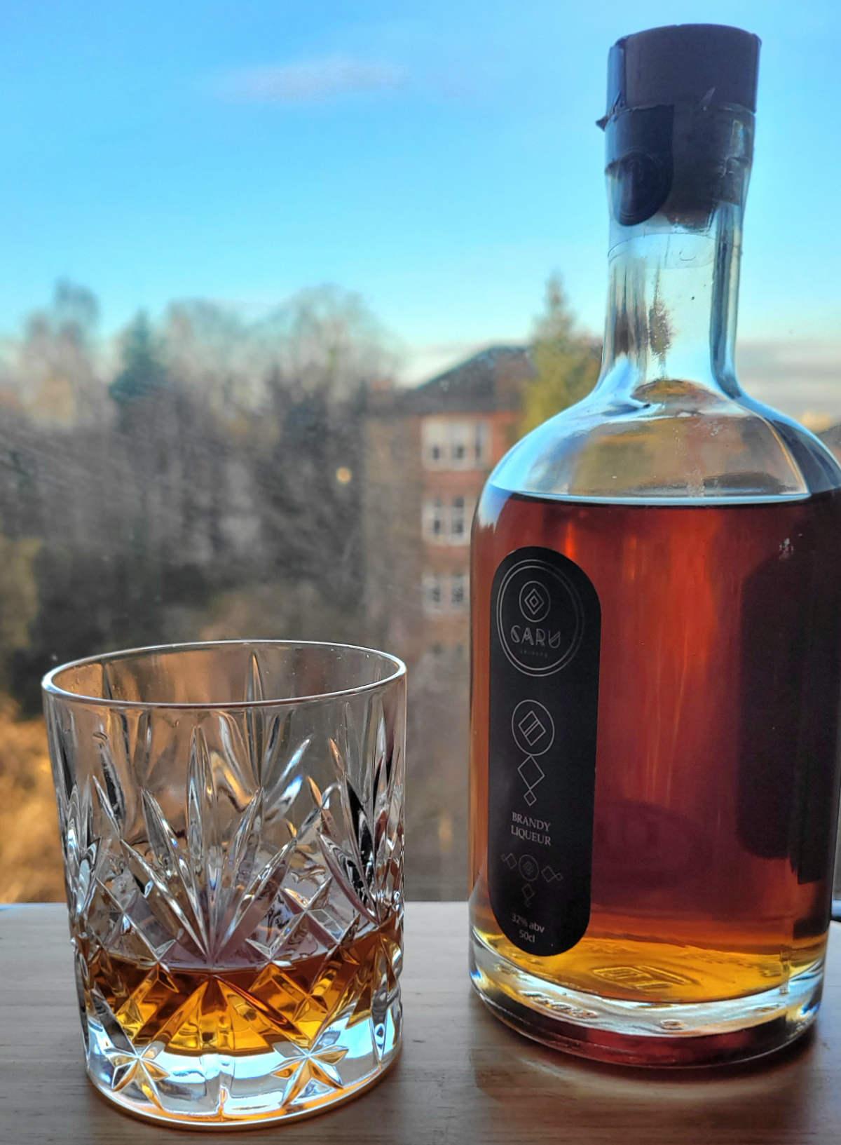 caru brandy bottle and glass