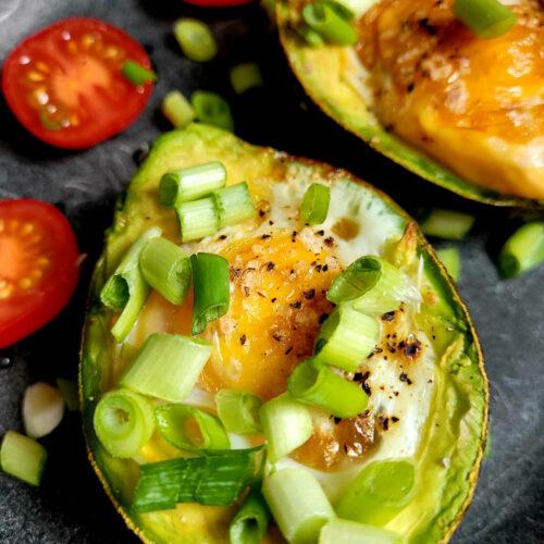 close up baked avocado eggs