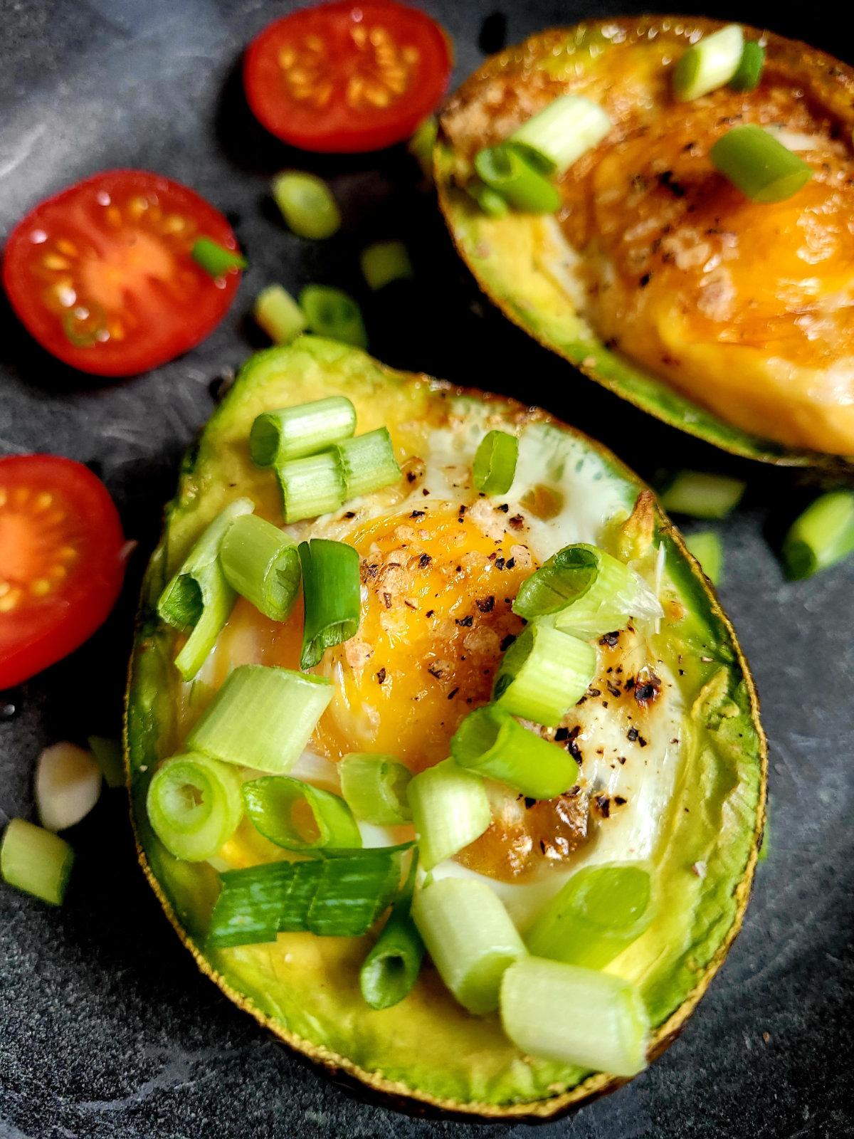 close up baked avocado eggs