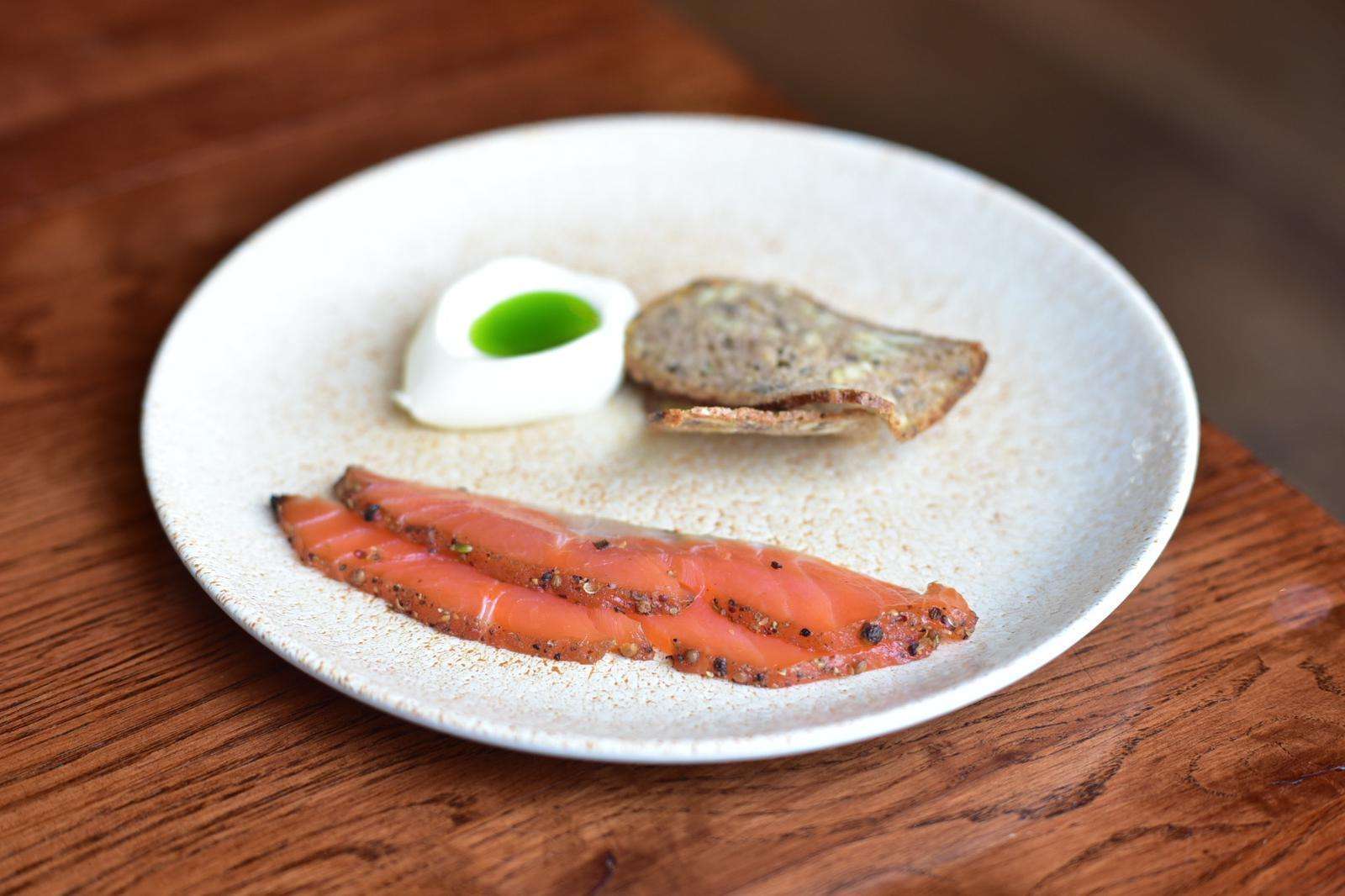 peppered trout, Katy rodgers crème fraîche and rye bread.